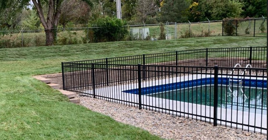 New sod laid to the edge of a pool enclosure.